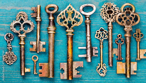 collection of old vintage keys on blue background photo