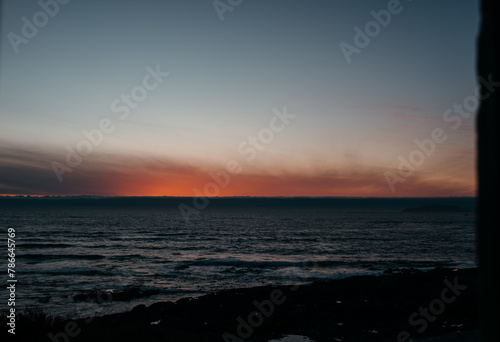 Twilight glow over coastal waters in Larino  Galicia
