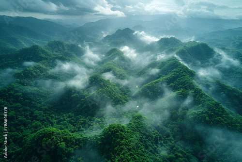 Mystic Mountain Mist  Lush green peaks enveloped by swirling clouds  embodying the mystery and majesty of nature  ideal for environmental and travel publications