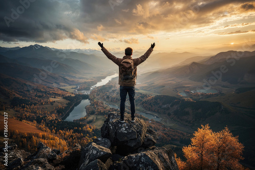 Man embracing nature on a mountain peak at sunset. Generative AI image © ADDICTIVE STOCK CORE