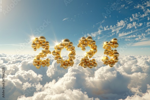 Golden helium balloons forming the year 2025 against a backdrop of clouds and bright sunlight photo