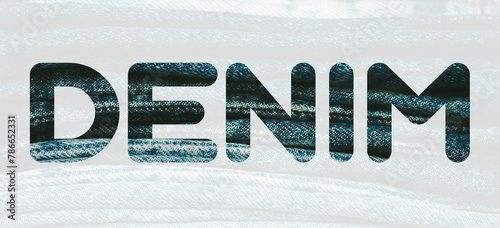 Word DENIM from denim blue pattern of folded jeans background. Fashion, stock and magazine concept. Denim font.