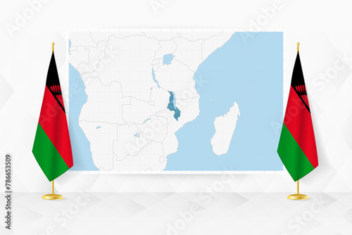 Map of Malawi and flags of Malawi on flag stand.