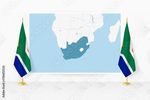 Map of South Africa and flags of South Africa on flag stand. photo