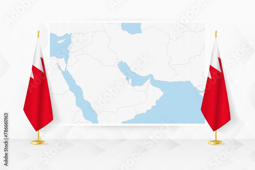 Map of Bahrain and flags of Bahrain on flag stand.