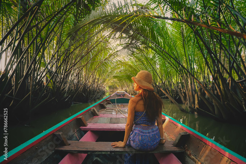 Soft focus on woman enjoying the view of Nipa palm or Nypa fruticans Wurmb on river