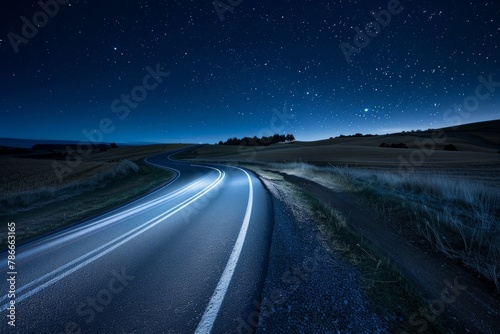 Rural Highway at Night, Illuminated by Starlight and Light Trails