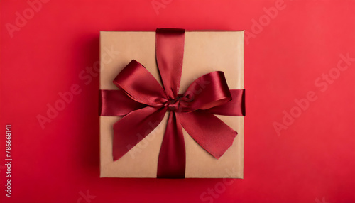 Top flat lay close up view photo of beautiful present box on red background