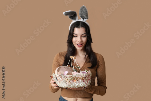 Pretty young woman in bunny...