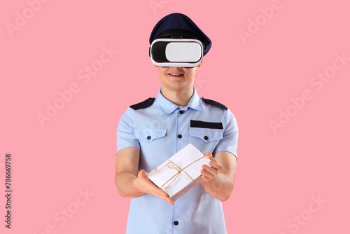 Young postman with letters ...