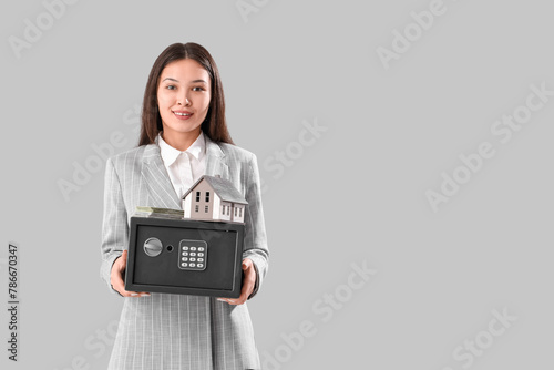 Young happy Asian woman wit...