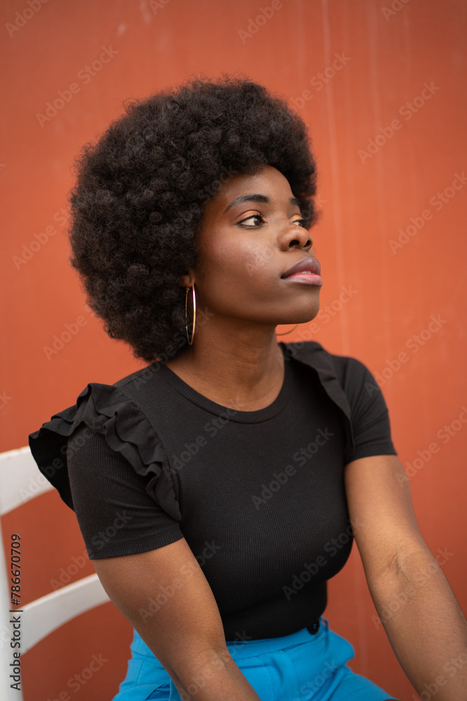 Contemplative Afro Woman in Casual Attire Contemplative Afro Woman in Casual Attire