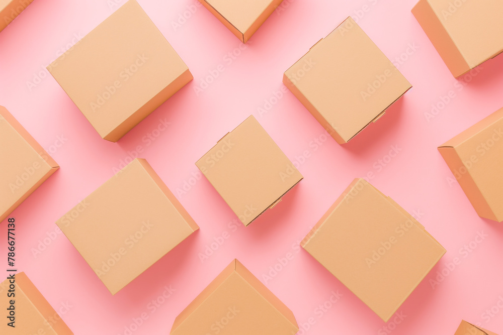 Group of brown cardboard boxes different size on pastel pink background. Mock up. Top view Group of brown cardboard boxes different size on pastel pink background. Mock up. Top view