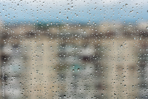Raindrops on window glass surface, background texture