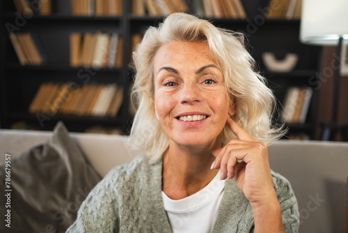 Portrait of confident stylish European middle aged senior woman. Older mature 60s lady smiling at home. Happy attractive senior female looking camera close up face headshot portrait. Happy people