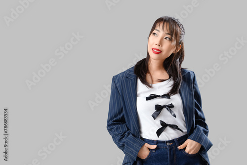 Stylish young Asian woman w...