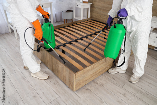 Male workers disinfecting b...