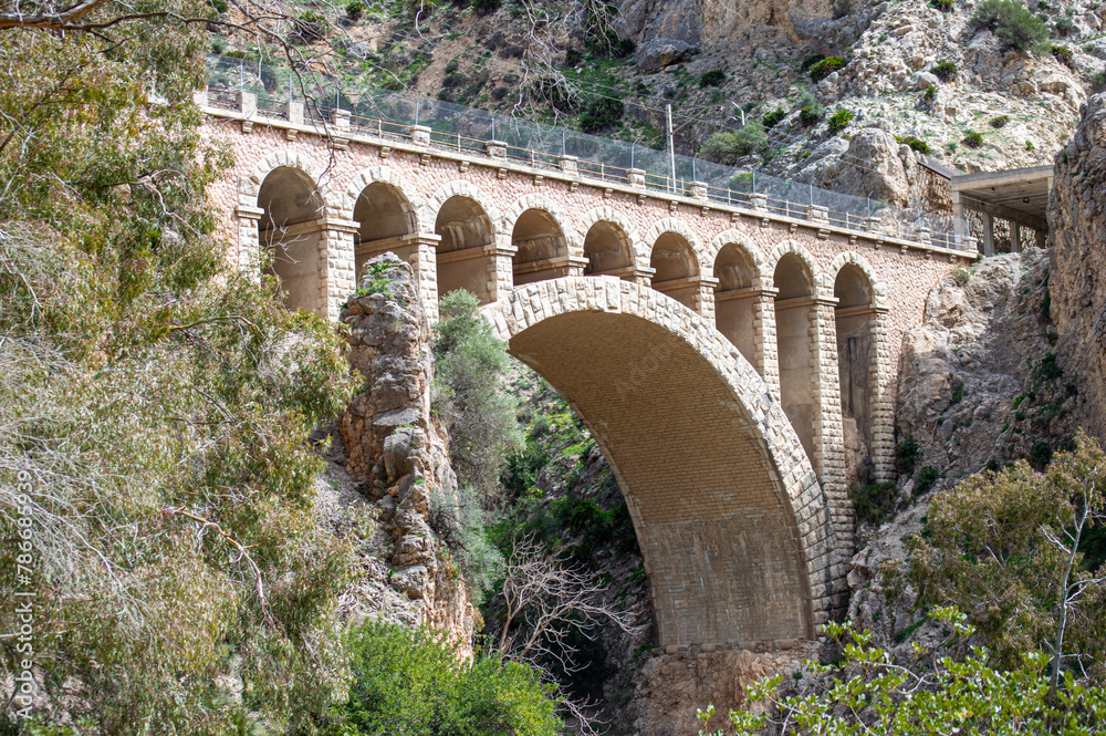 Obraz premium Caminito del Ray, The King's Path. Walkway pinned along the steep walls of a narrow gorge in El Chorro, Malaga, Spain