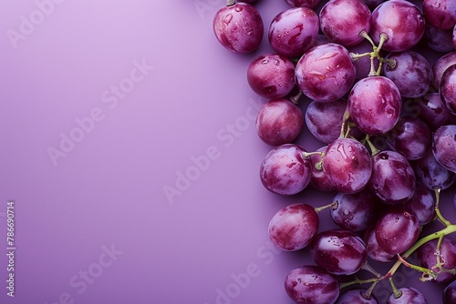 Juicy slices of grapes displayed in a staggered pattern on a soft purple background, with space at the top for text photo