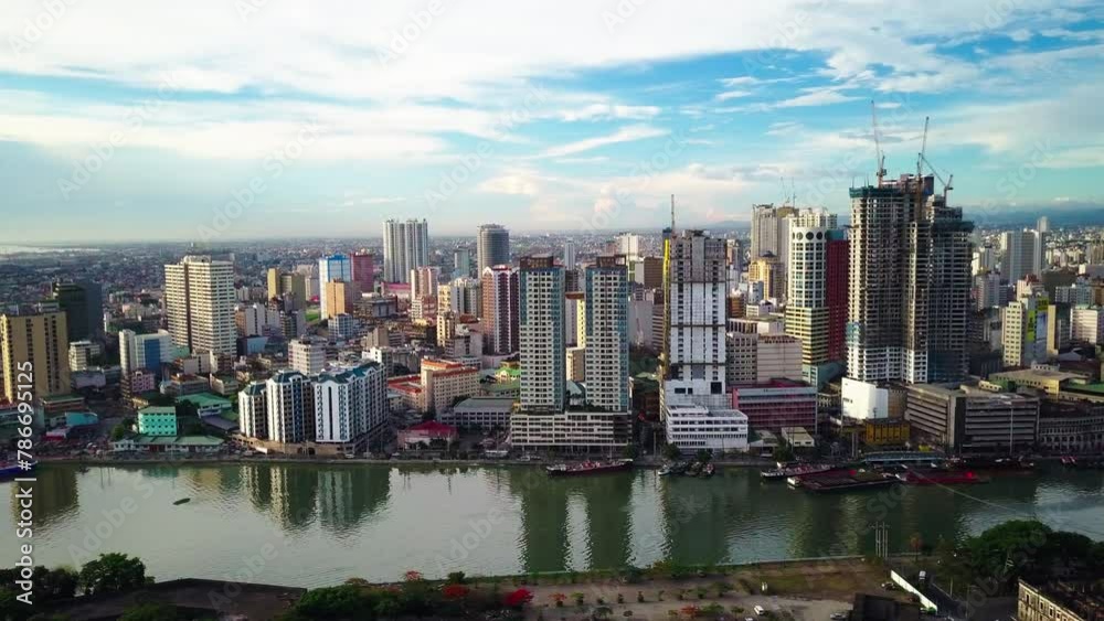Aerial Panning Scenic View Of Modern Downtown District In City By Canal Under Cloudy Sky - Manila, Philippines Aerial Panning Scenic View Of Modern Downtown District In City By Canal Under Cloudy Sky - Manila, Philippines