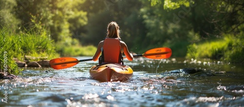 Female kayaker in scenic river, exploring nature s beauty in summer, outdoor adventure concept