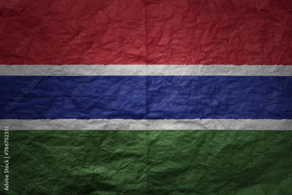 big national flag of gambia on a grunge old paper texture background