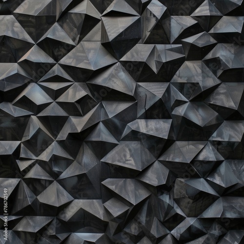 Abstract triangular mosaic tiles in dark black and anthracite gray concrete. Geometric fluted triangles create a textured wallpaper backdrop.