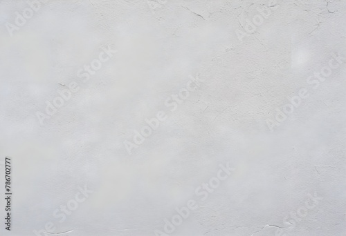 Close-up texture of a white plastered wall with subtle variations and imperfections