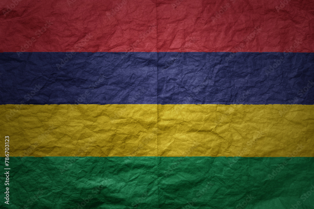 big national flag of mauritius on a grunge old paper texture background