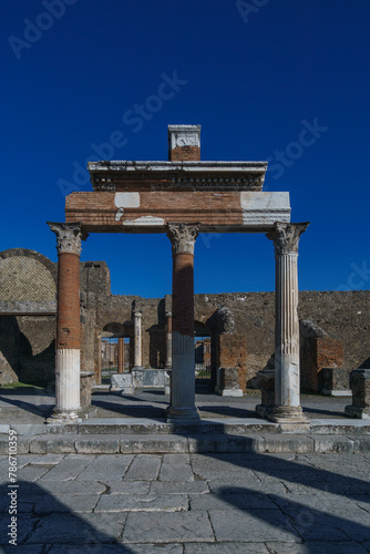 View of columns at the ruins of the Forum on a sunny day with clear blue sky, Pompeii, Campania, Italy