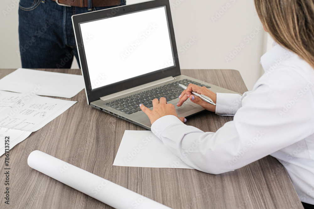 Fototapeta premium Discussion of projects and strategies. A business meeting at an engineering firm, where professionals discuss projects and delivery dates.