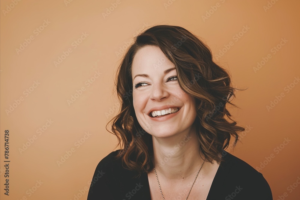Portrait of a beautiful woman with curly hair on a yellow background Portrait of a beautiful woman with curly hair on a yellow background