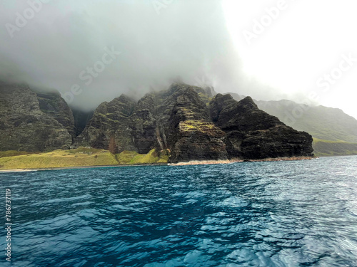 Green coastal cliffs, beaches, and ocean of Kauai Hawaii