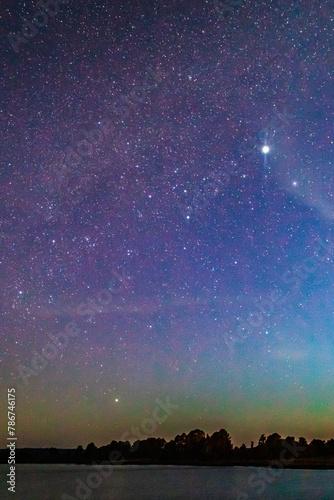 Lagoon at starry night with windmills on the shore, Laguna de los Gamboa in Monte Escobedo, Zacatecas