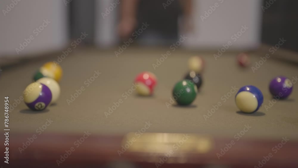 Breaking colorful pool balls on green billiards table for start to play. American pool, poule. Billiard balls with numbers on a pool table
