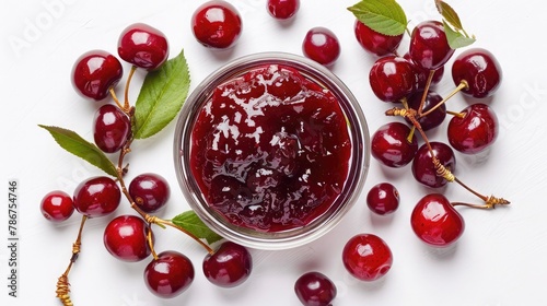 Small glass bowl of red berry jam isolated on white background, sweet cherry jam, top view photo