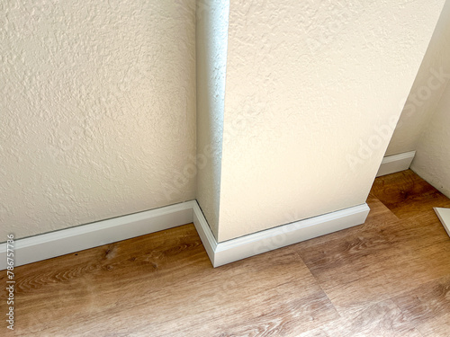Installing Vinyl Baseboards in a Modern Home Renovation Project