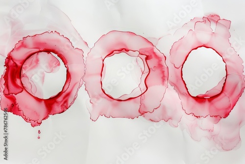red wine stain rings on white paper creating abstract watercolor art background