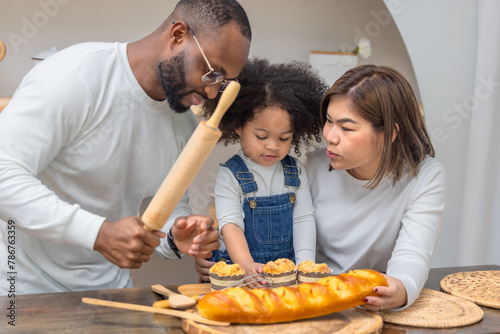 Multiracial Family Spending Quality Time Together Baking Bread in a Cozy Kitchen Setting