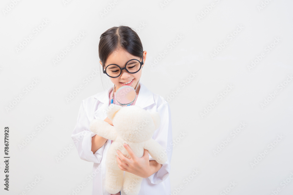 Cute little girl asian with stethoscope playing doctor Cute little girl asian with stethoscope playing doctor
