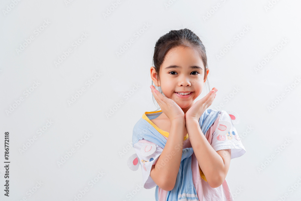 Cheerful Asian girl Posing cutely on a white background Cheerful Asian girl Posing cutely on a white background