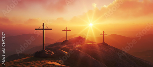 A crosses on the top of the mountain at sunrise  religion concept. 