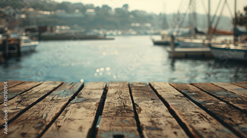 A wooden pier with a view of the water and boats © tope007