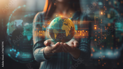 A woman is holding a globe in her hands. The globe is surrounded by a lot of numbers and graphs. The woman is wearing a black shirt and she is focused on the globe