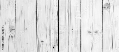 A detailed view of a white wooden wall showcasing a monochromatic photograph in black and white hues photo