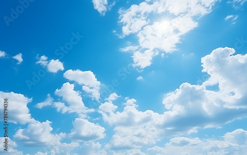 blue sky background with tiny clouds and bright sun,