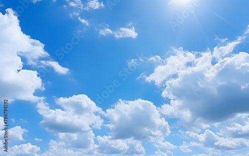 blue sky background with tiny clouds and bright sun 