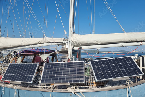 solar panes on sailing boat electric power sea blue sun photo