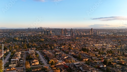 Beautiful sunset over the skyline of Burnaby in the Lower Mainland during a spring season in British Columbia, Canada photo