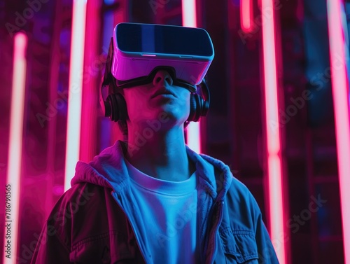 A young man wearing VR glasses.